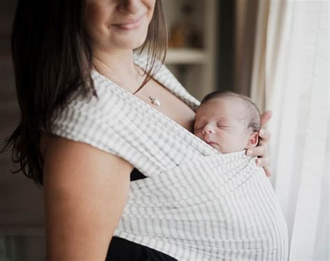 Premium Photo | Mother holding new born baby close to her chest